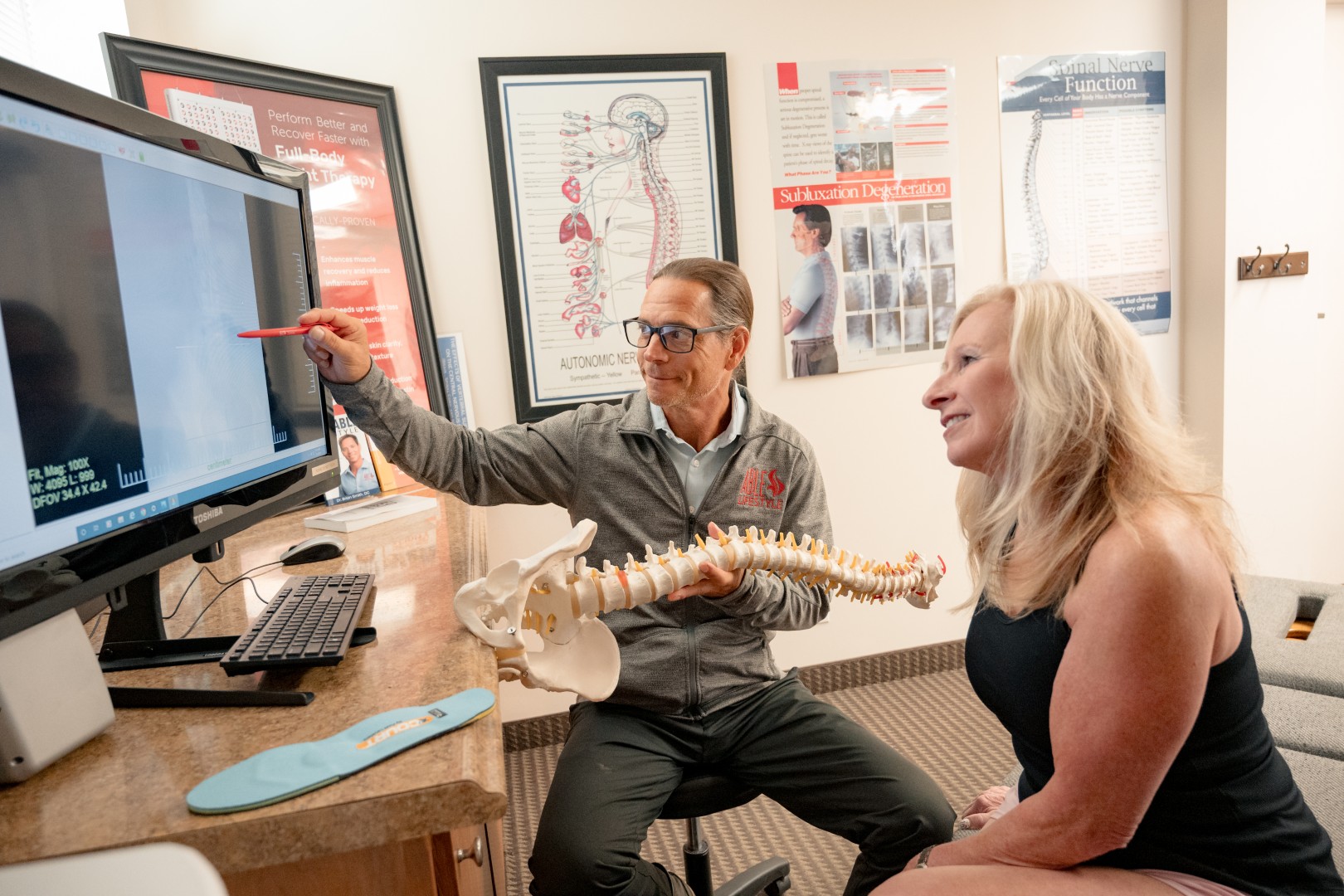 Dr. Brian explaining treatment to patient