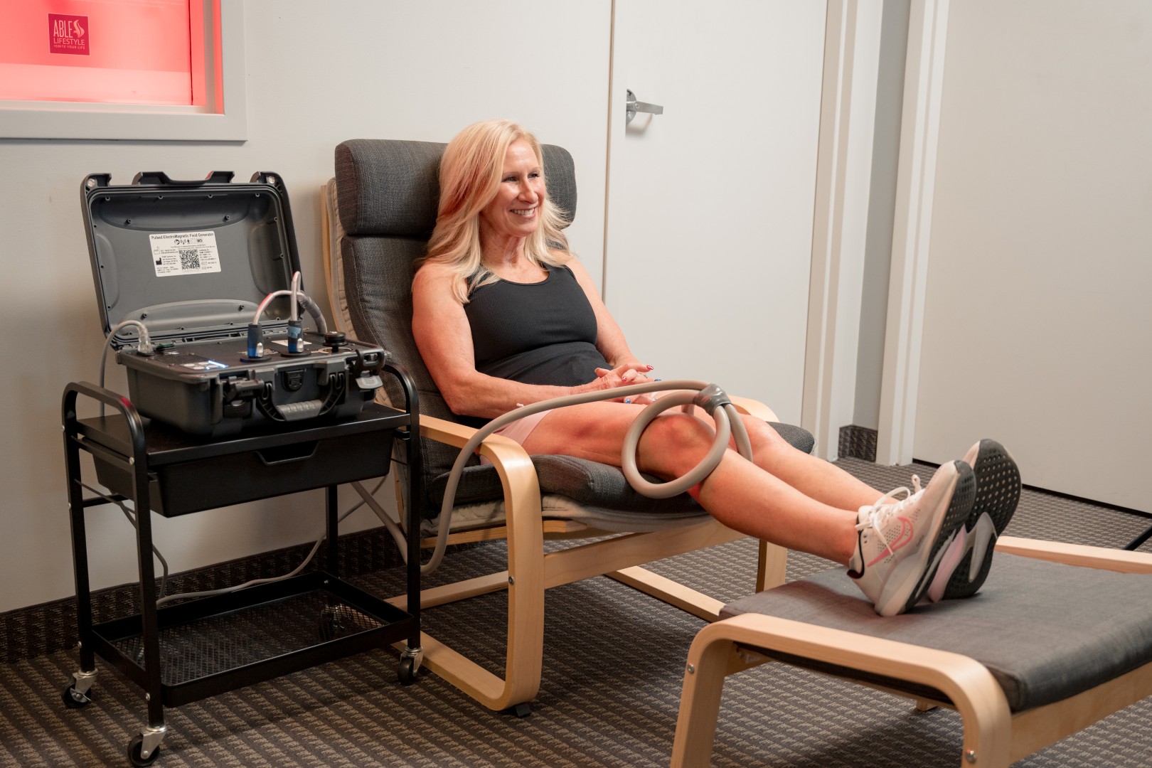 Patient receiving PEMF therapy on their knee